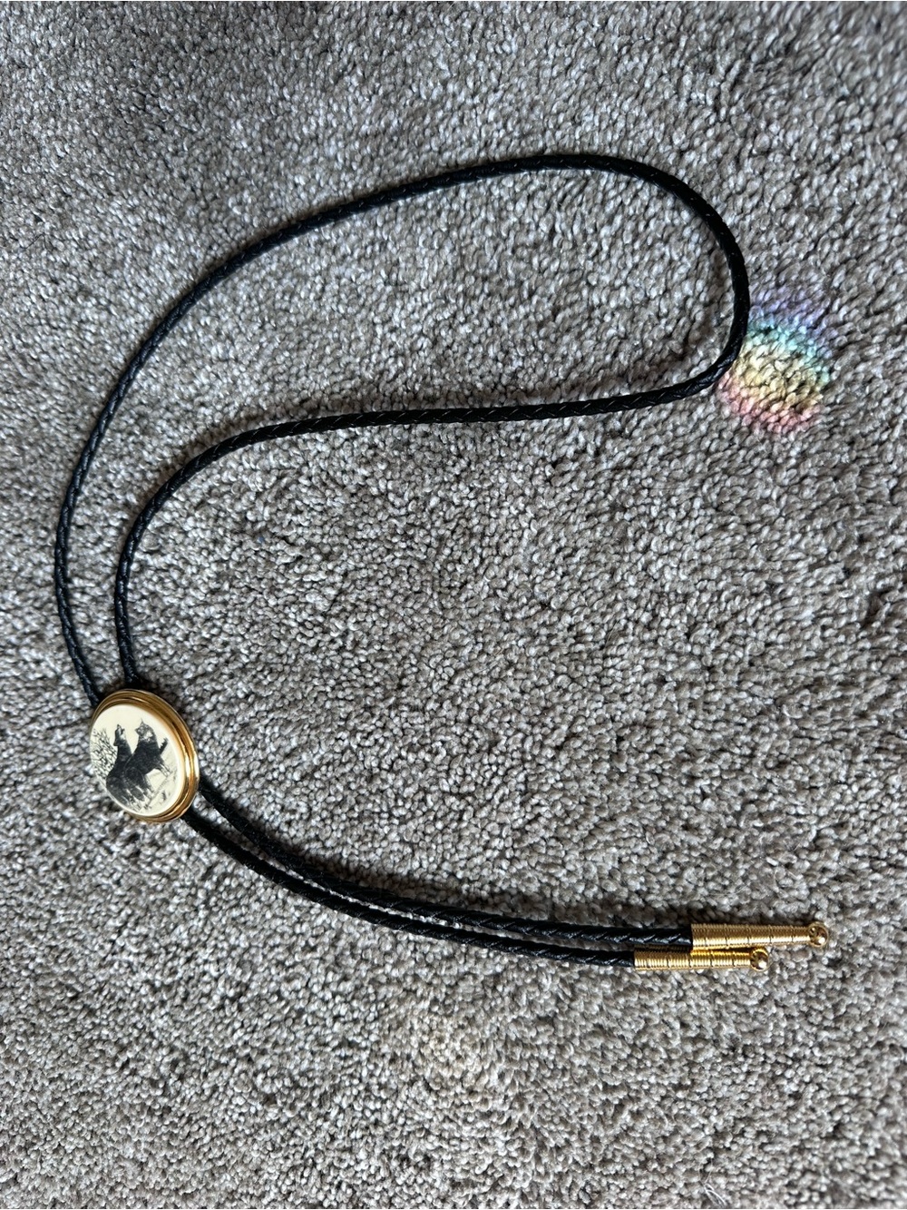 Vintage-Inspired Black Leather Bolo Tie with Wolf Medallion